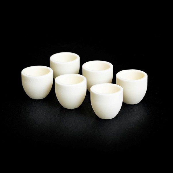 Magnesium oxide crucibles manufactured from refractory ceramic material for high-temperature laboratory and industrial applications.
